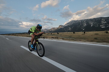 Image showing triathlon athlete riding bike