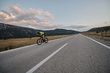 Image showing triathlon athlete riding bike