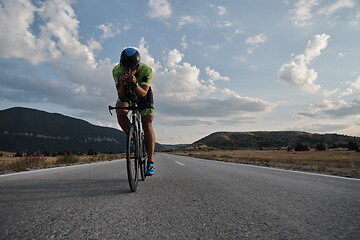 Image showing triathlon athlete riding bike