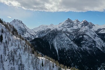 Image showing aerial snow covered mountain peaks in alps at winter 