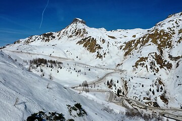 Image showing aerial snow covered mountain peaks in alps at winter 