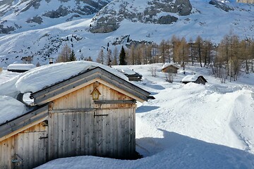 Image showing aerial snow covered mountain peaks in alps at winter 