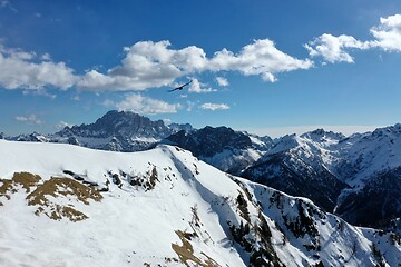 Image showing aerial snow covered mountain peaks in alps at winter 