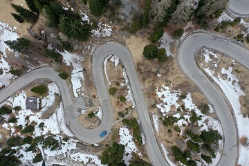 Image showing alpine curvy road on winter top view