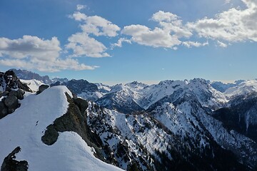 Image showing aerial snow covered mountain peaks in alps at winter 