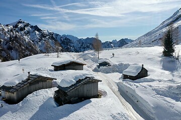 Image showing aerial snow covered mountain peaks in alps at winter 