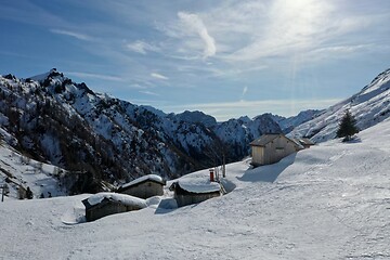 Image showing aerial snow covered mountain peaks in alps at winter 