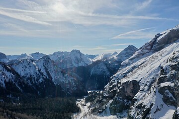 Image showing aerial snow covered mountain peaks in alps at winter 