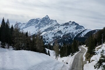 Image showing aerial snow covered mountain peaks in alps at winter 