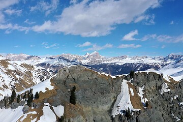 Image showing aerial snow covered mountain peaks in alps at winter 