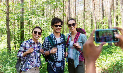 Image showing friends with backpacks being photographed on hike