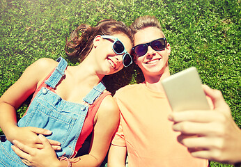 Image showing happy couple taking selfie on smartphone at summer