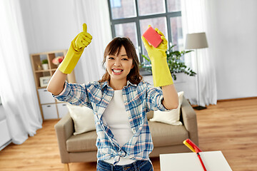 Image showing happy asian woman with sponge cleaning at home