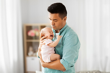 Image showing middle aged father with baby daughter at home