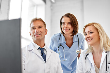 Image showing group of doctors with computer at hospital