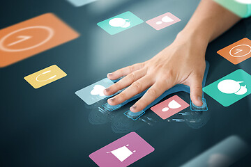 Image showing hand scanning on touch screen with app icons