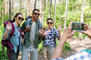 Image showing friends with backpacks being photographed on hike