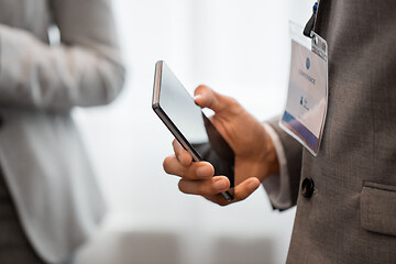 Image showing businessman with smartphone at business conference