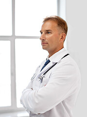 Image showing smiling doctor in white coat at hospital