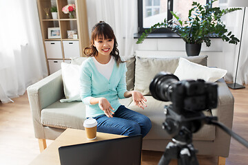 Image showing asian female blogger with camera recording video