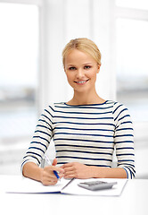 Image showing student woman with notebook and calculator