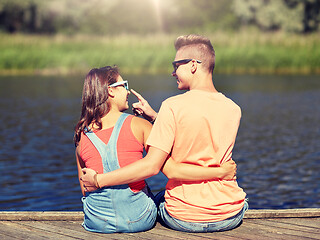 Image showing happy teenage couple hugging on river summer berth