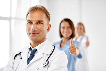 Image showing smiling doctor in white coat at hospital