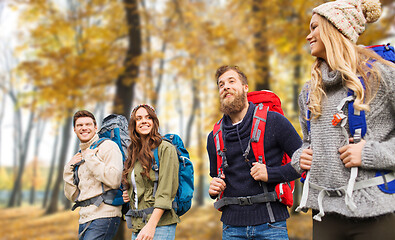 Image showing friends with backpacks hiking in autumn