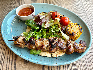 Image showing pork kebab meat on wooden skewer