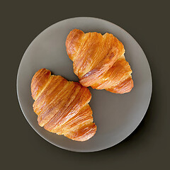 Image showing two fresh croissants on grey plate