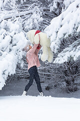 Image showing Happy go lucky woman playing in snow