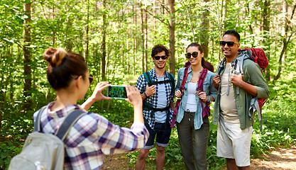 Image showing friends with backpacks being photographed on hike