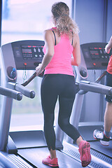 Image showing woman exercising on treadmill in gym