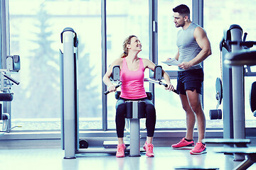 Image showing woman exercising with her personal trainer