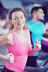 Image showing woman exercising on treadmill in gym