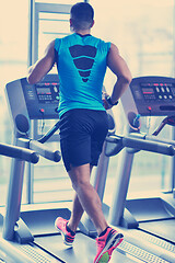 Image showing man running on the treadmill