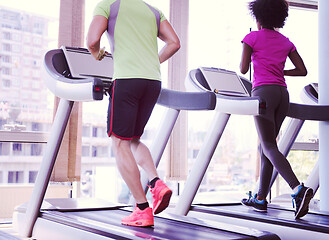 Image showing people exercisinng a cardio on treadmill in gym