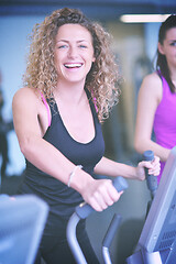 Image showing woman exercising on treadmill in gym