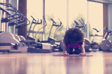 Image showing african american woman exercise yoga in gym