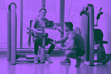 Image showing woman exercising with her personal trainer