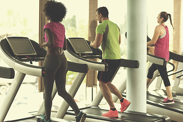 Image showing people exercisinng a cardio on treadmill