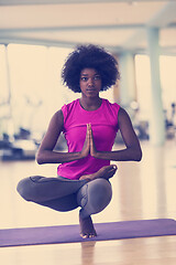 Image showing african american woman exercise yoga in gym