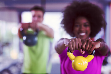 Image showing couple  workout with weights at  crossfit gym