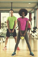 Image showing couple  workout with weights at  crossfit gym