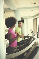 Image showing people exercisinng a cardio on treadmill in gym