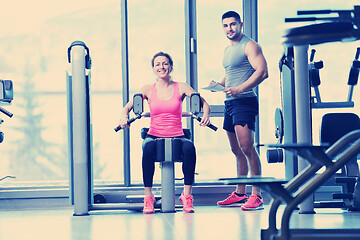 Image showing woman exercising with her personal trainer