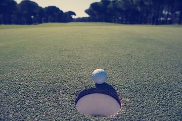 Image showing golf ball in the hole