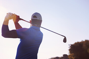 Image showing golf player hitting shot