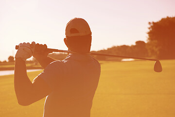 Image showing golf player hitting shot