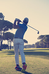 Image showing golf player hitting shot